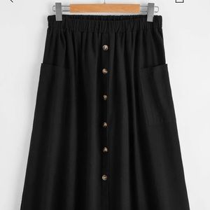 Mid-length black button up skirt